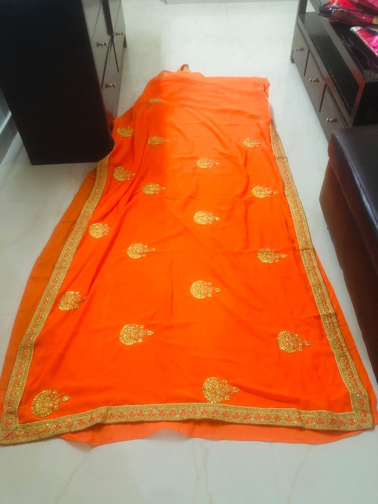 beautiful golden embroidery border orange saree