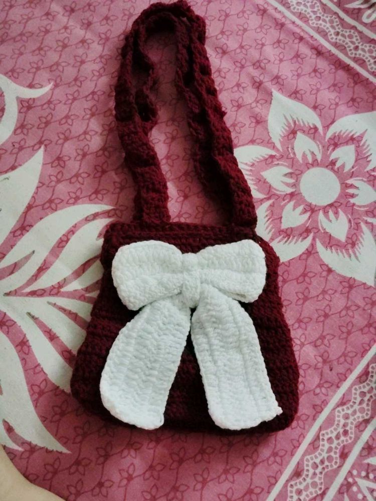 151.Crocheted Maroon Bag with White Bow