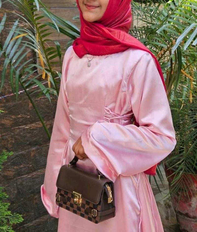 Elegant Pink Gown with Red Scarf