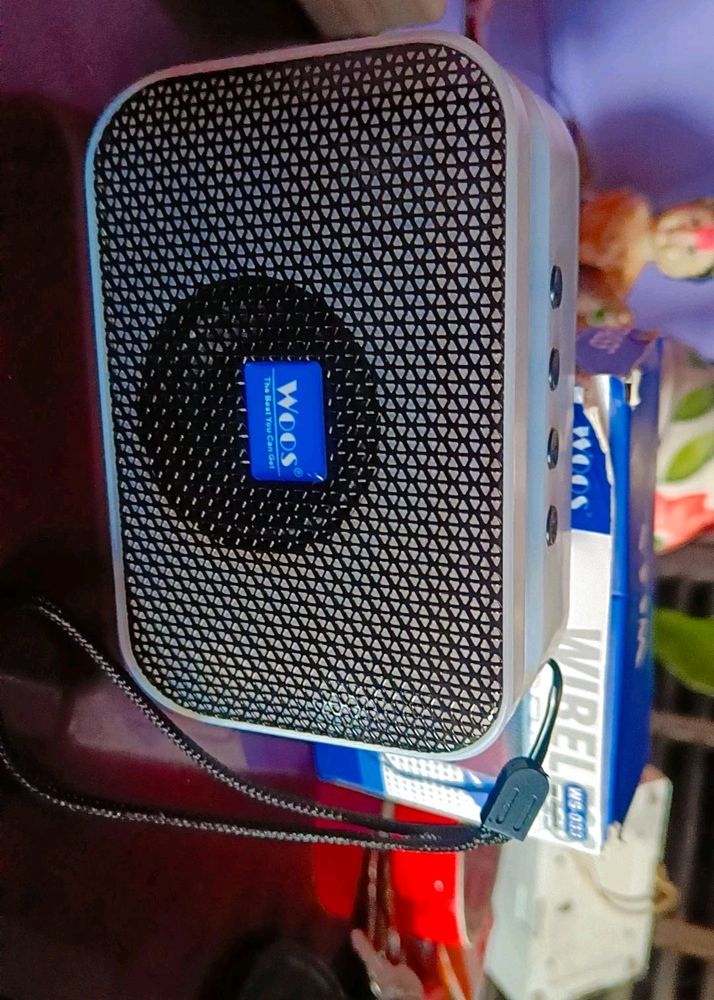 Brand New Woos Company Bass Wireless Speaker.            1- wireless.   2- Playing Time:3-4 hours.   3- Play USB Storage Device.     4- With Mic For Hands- Free Phone Call Function.   5- Splash proof