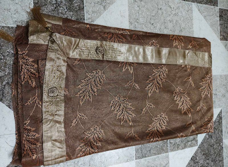 Elegant Brown Saree with Leaf Motif