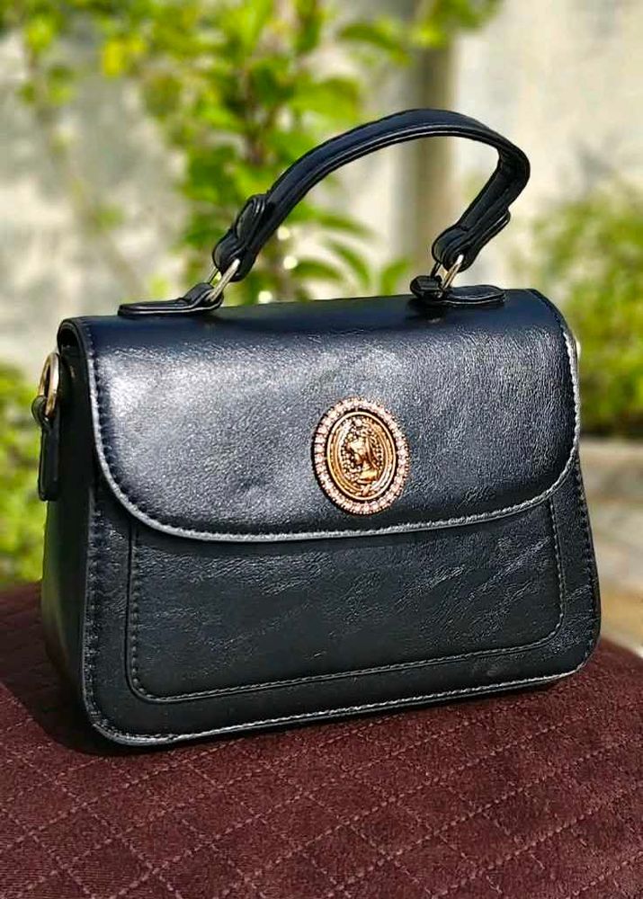 Chic Black Handbag with Embellished Detail