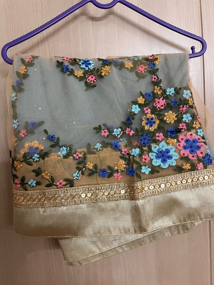 Powder blue floral net saree