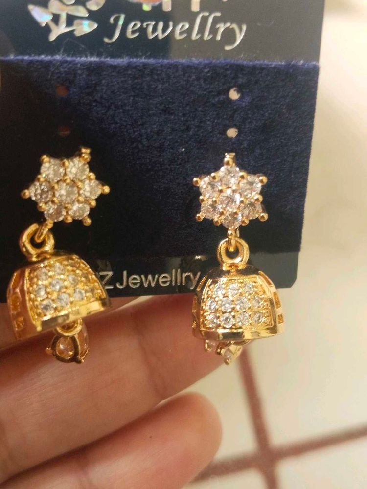 Gold Jhumka Earrings with CZ Stones