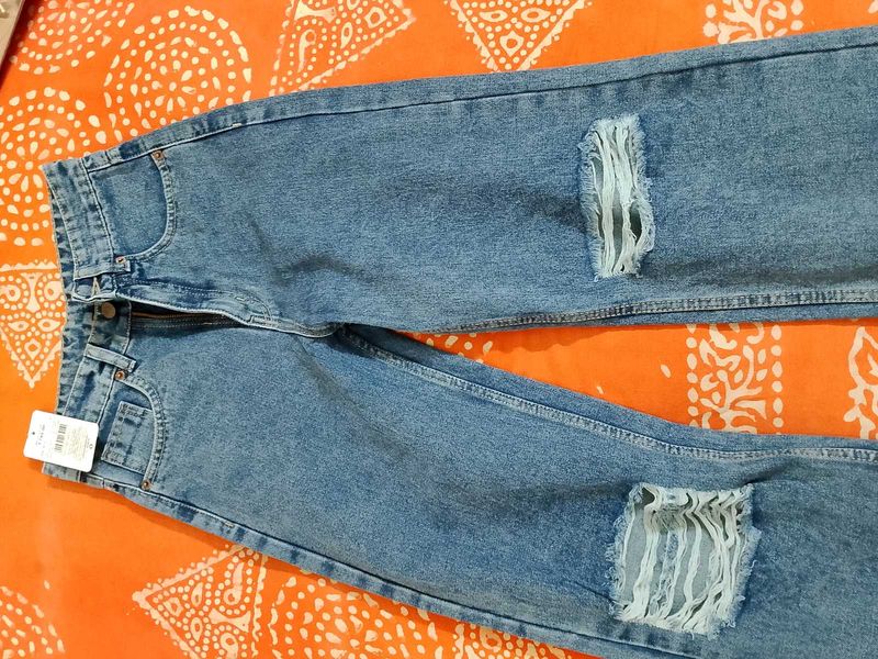 Distressed Blue Denim Jeans