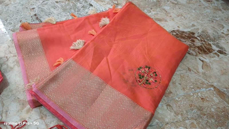 Elegant Orange Saree with Tassels