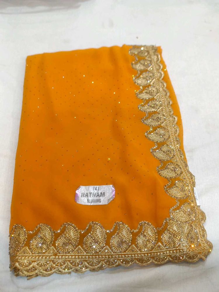Vibrant Orange Saree with Gold Embroidery