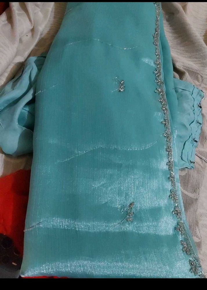 Elegant Teal Saree with Silver Embellishments