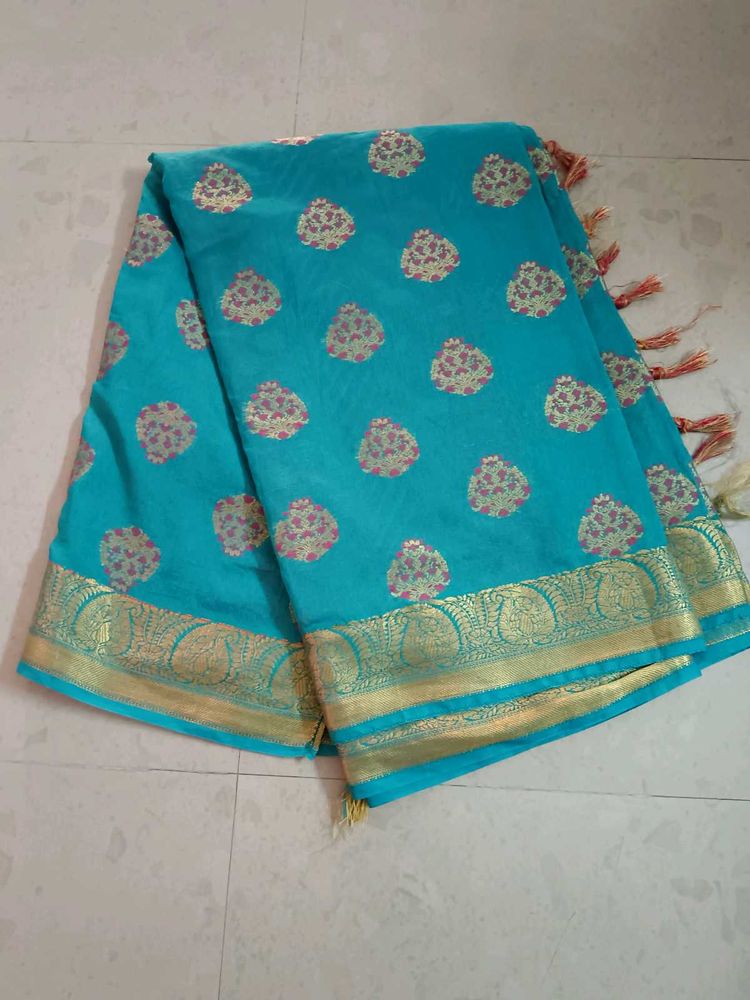 Beautiful Teal Saree with Gold Border