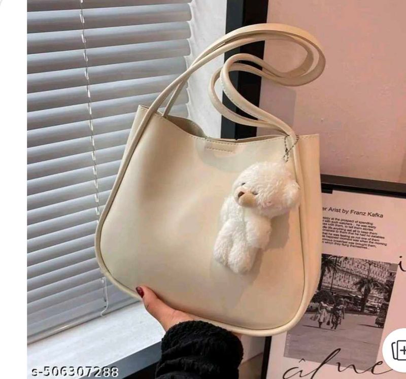 Chic Cream Shoulder Bag with Cute Charm