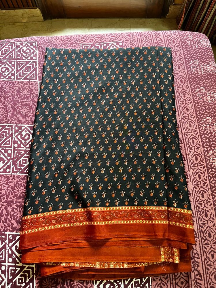 Elegant Black Saree with Orange Border