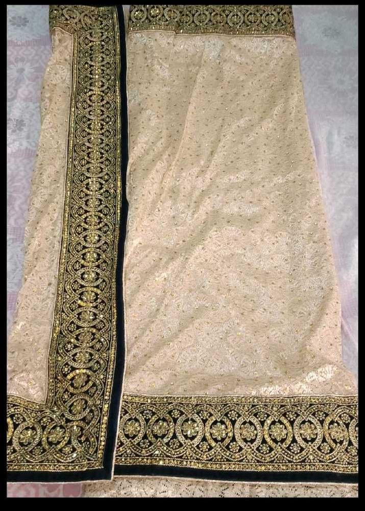 Elegant Beige Embroidered Saree