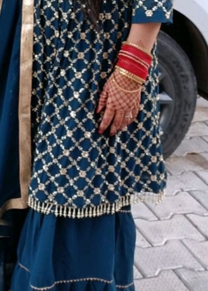 newly sharara suit with embroidery and stars work and also duptta work with lase