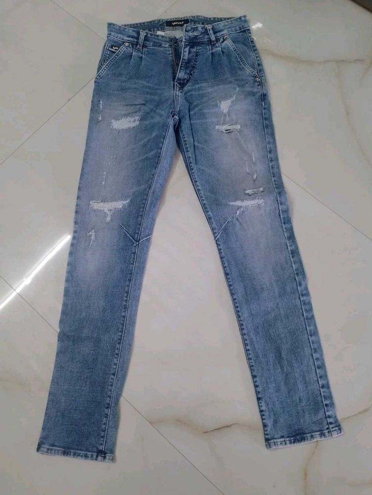 Distressed Light Wash Denim Jeans