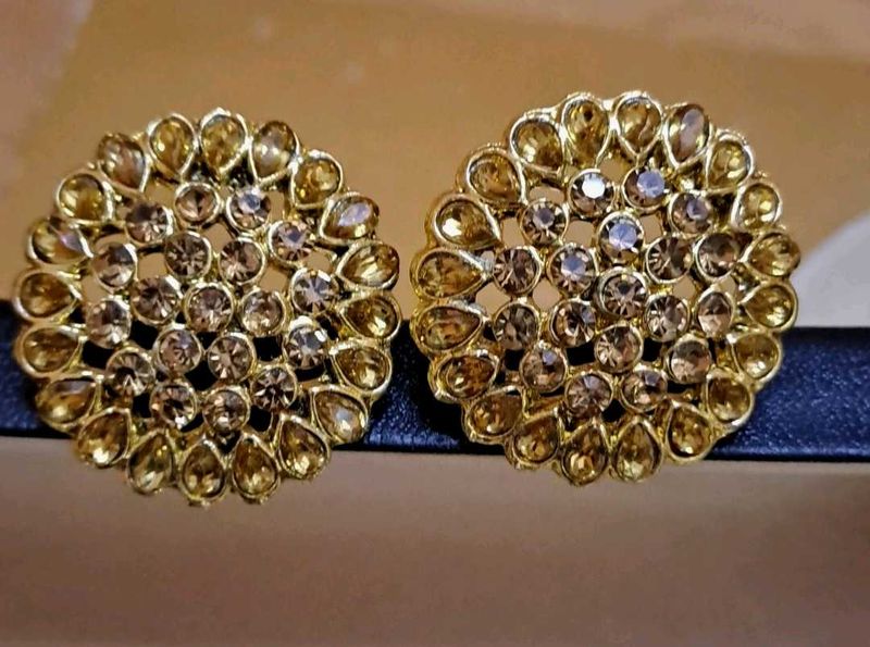 golden round studs