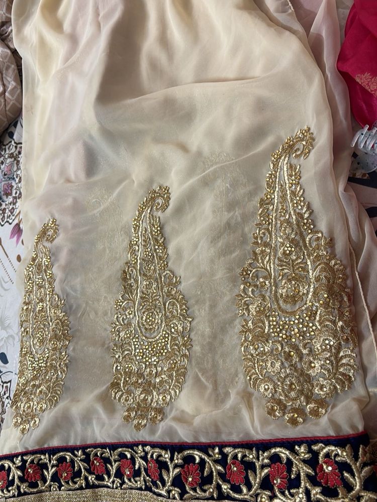 Elegant Cream Saree with Gold Embroidery