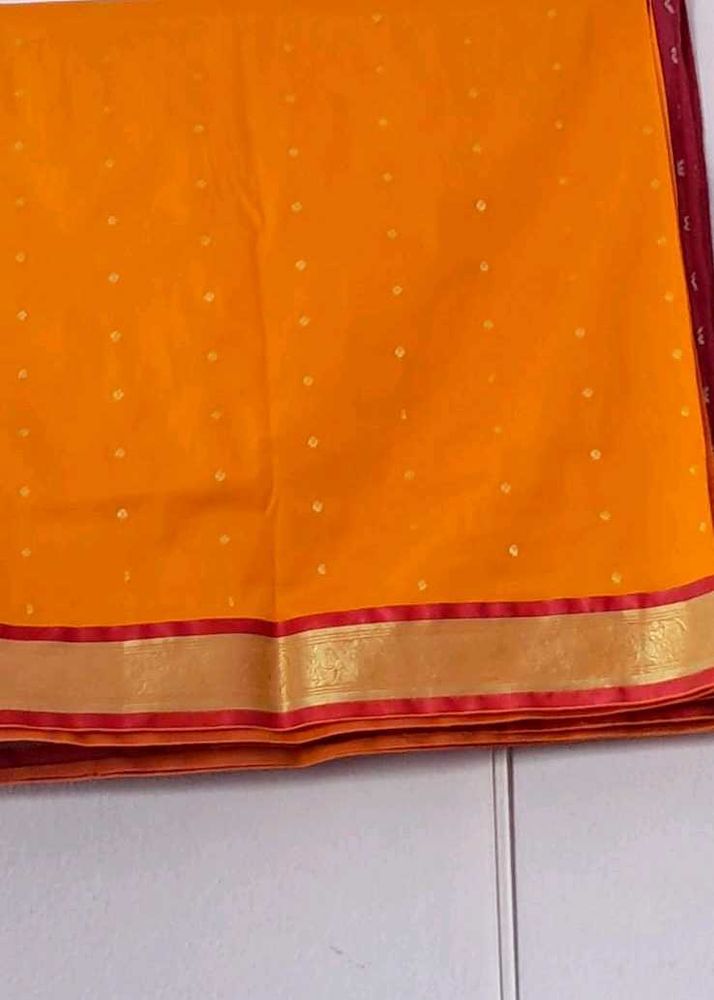 Vibrant Orange Saree with Gold Border