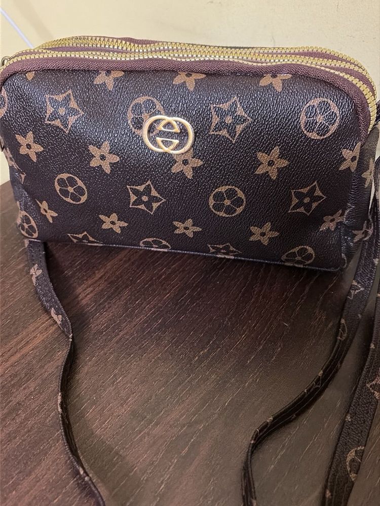 Spacious 3 compartment sling bag