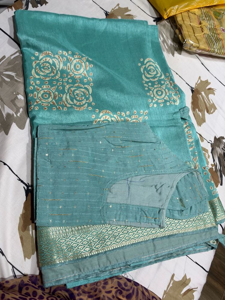 Beautiful Teal Saree with Embellishments
