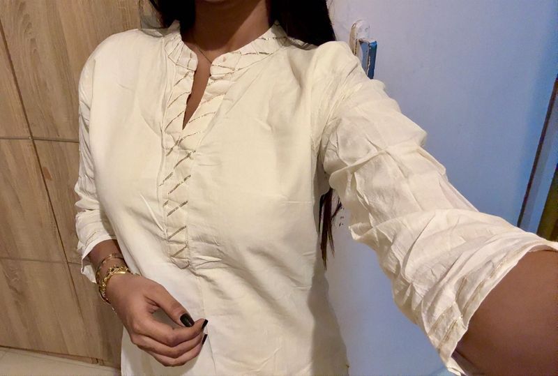 Elegant Cream Kurta with Embellished Neckline