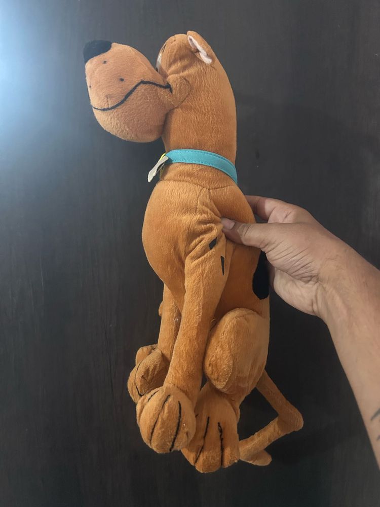 brown Scooby-Doo plush toy wearing a blue collar