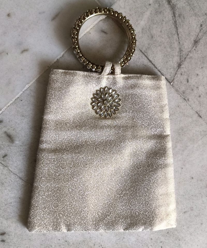 Cream Coloured Jacquard Wrist Pouch