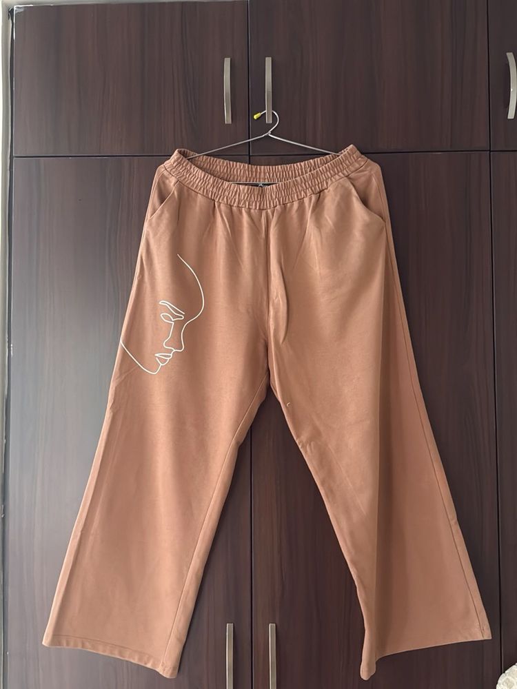 Brown Wide-Leg Pants with Abstract Face Art