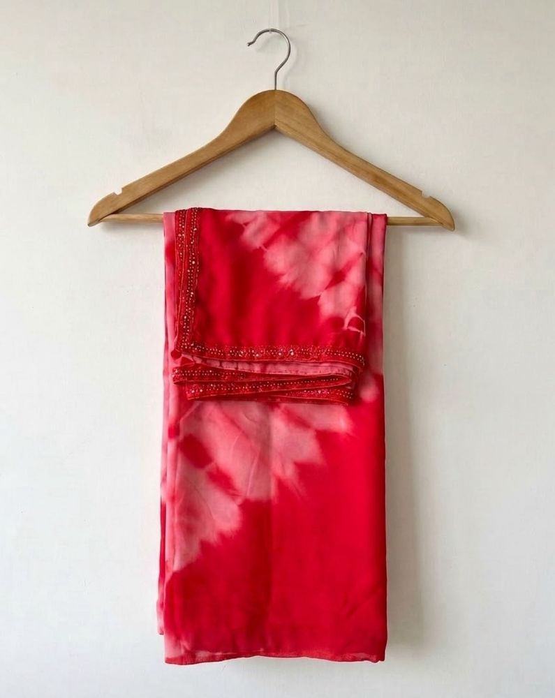 Stunning red tie-dye saree with unique embellishme
