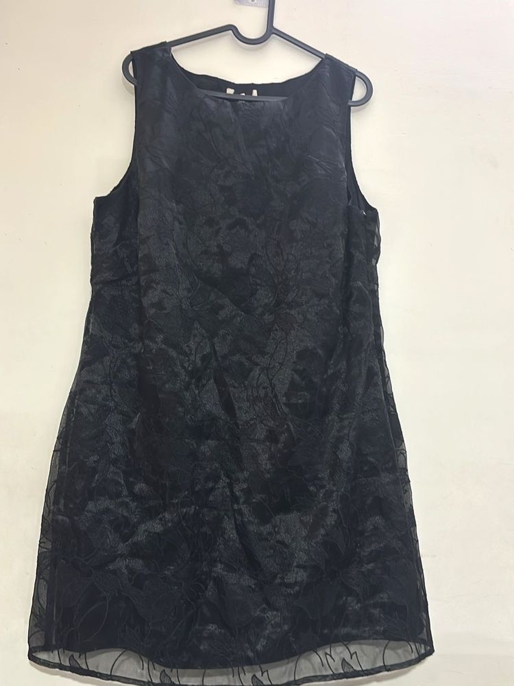 Shiny reflecting black dress