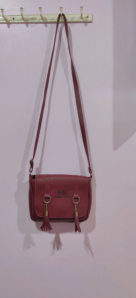 Adjustable sling handbag