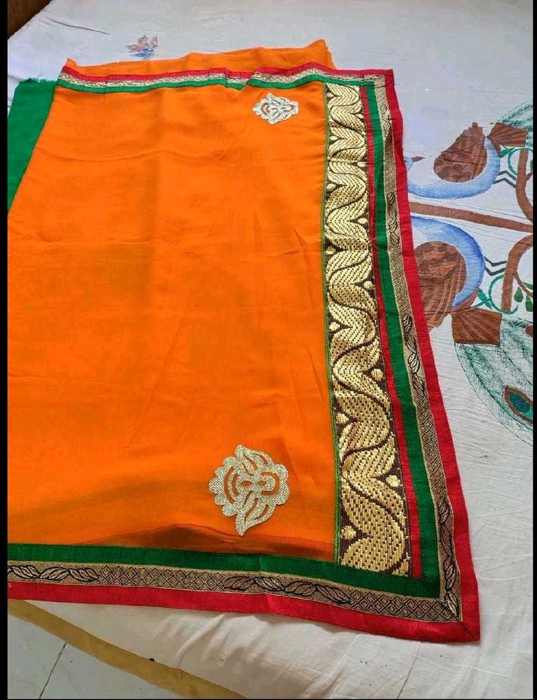 Vibrant Orange Saree with Golden Border
