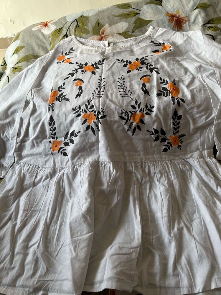 Embroidered White Peplum Top