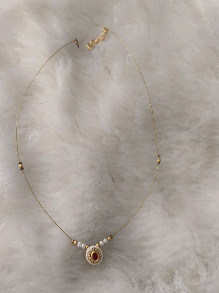 Delicate Gold Necklace with Red Stone