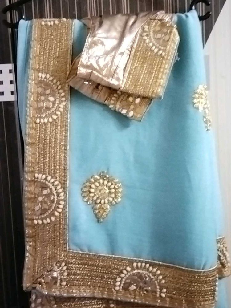 Stunning Blue Saree with Golden Embellishments