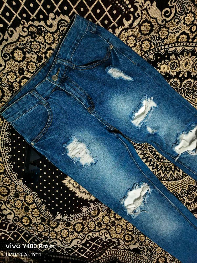 Distressed Blue Denim Jeans