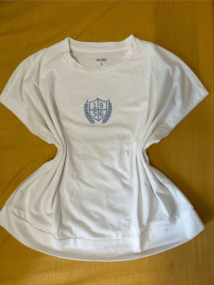 White Top with Crest Design