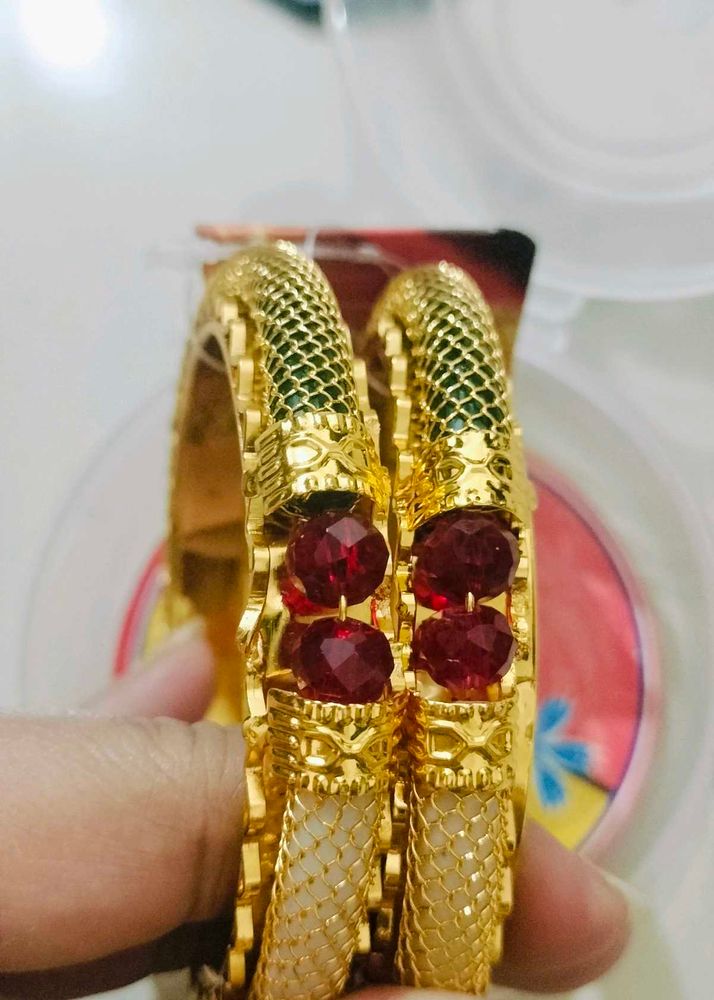 Brand new Elegant Gold Bangles with Red Stones