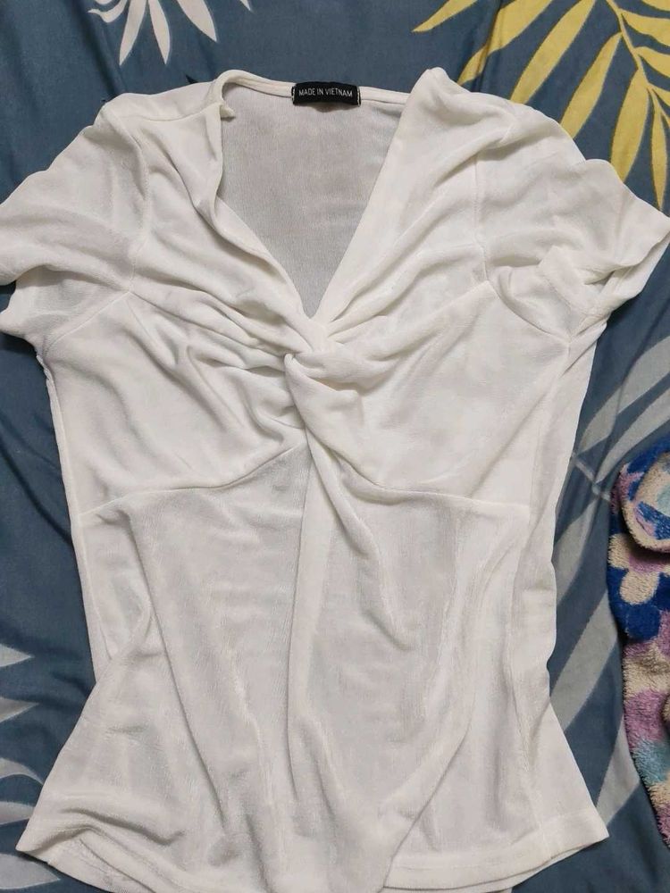 white top shimmery ish material