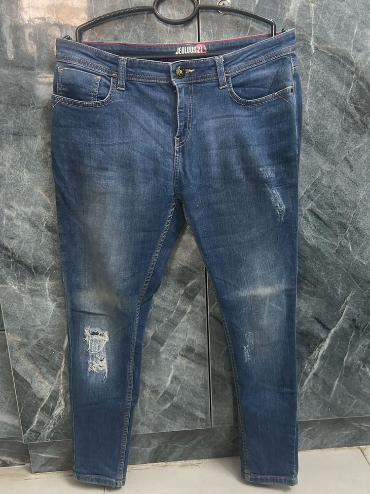 Distressed Blue Denim Jeans