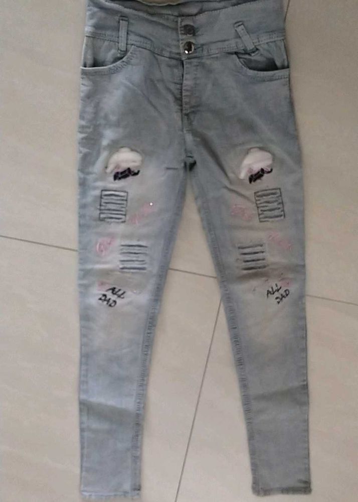 Light Wash Distressed Jeans with Patches