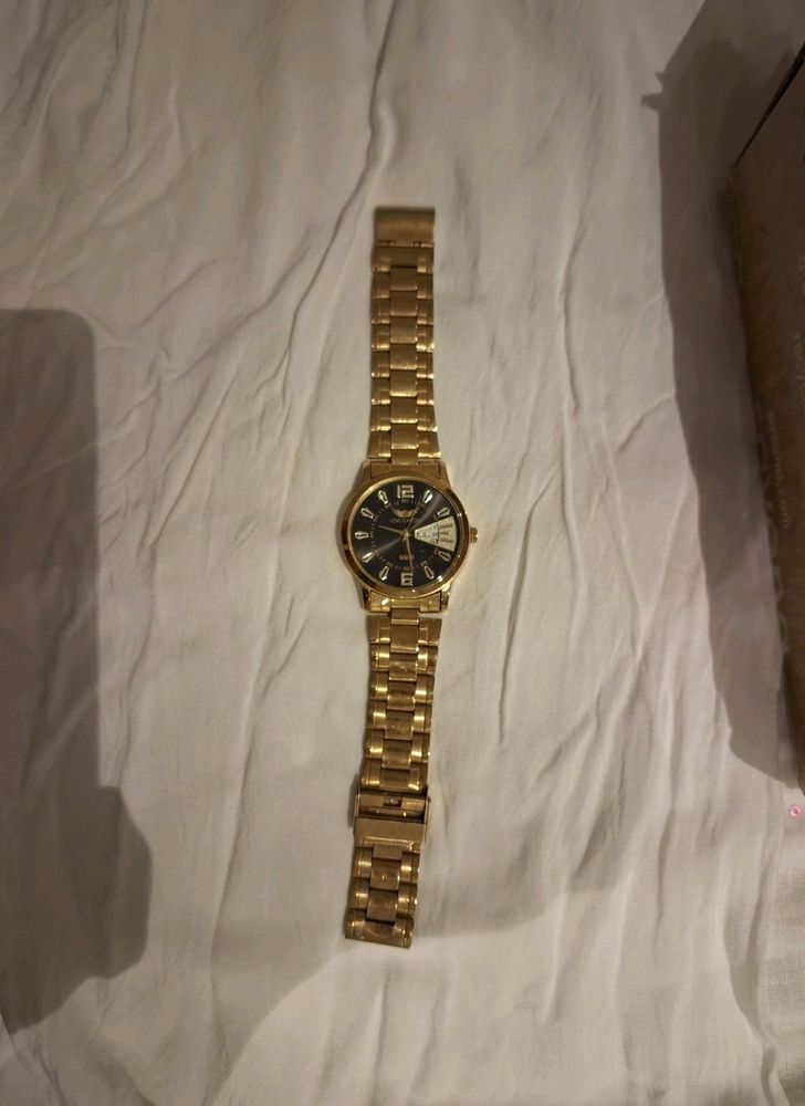 LOIS CARON Gold Pleated Watch For Men..
