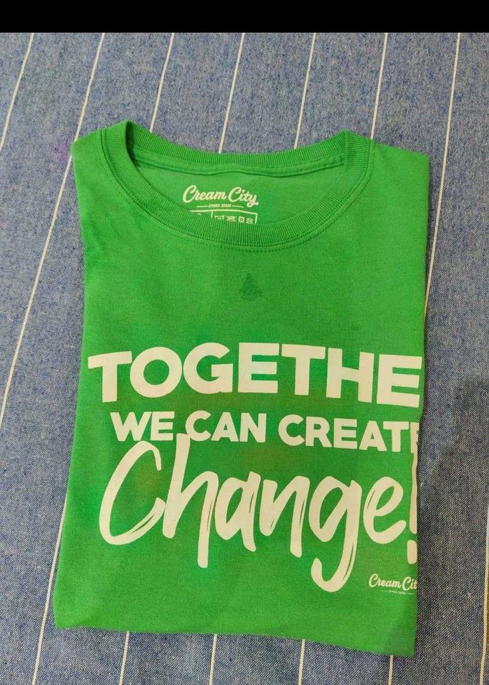 Green Tshirt with Tan shorts