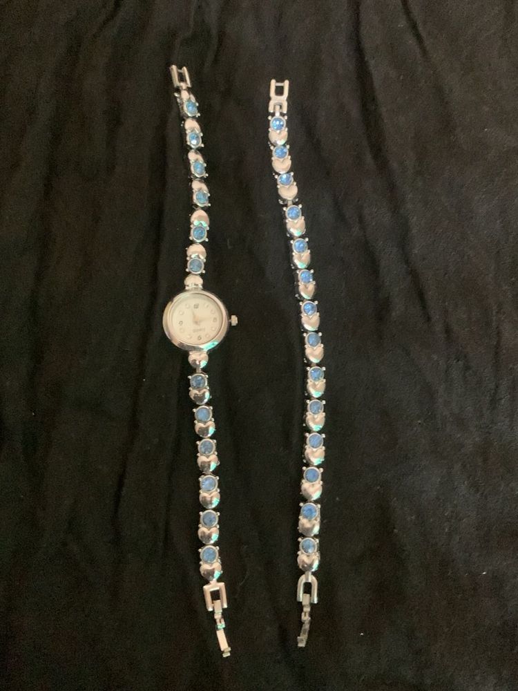 Elegant Silver Watch with Blue Stones