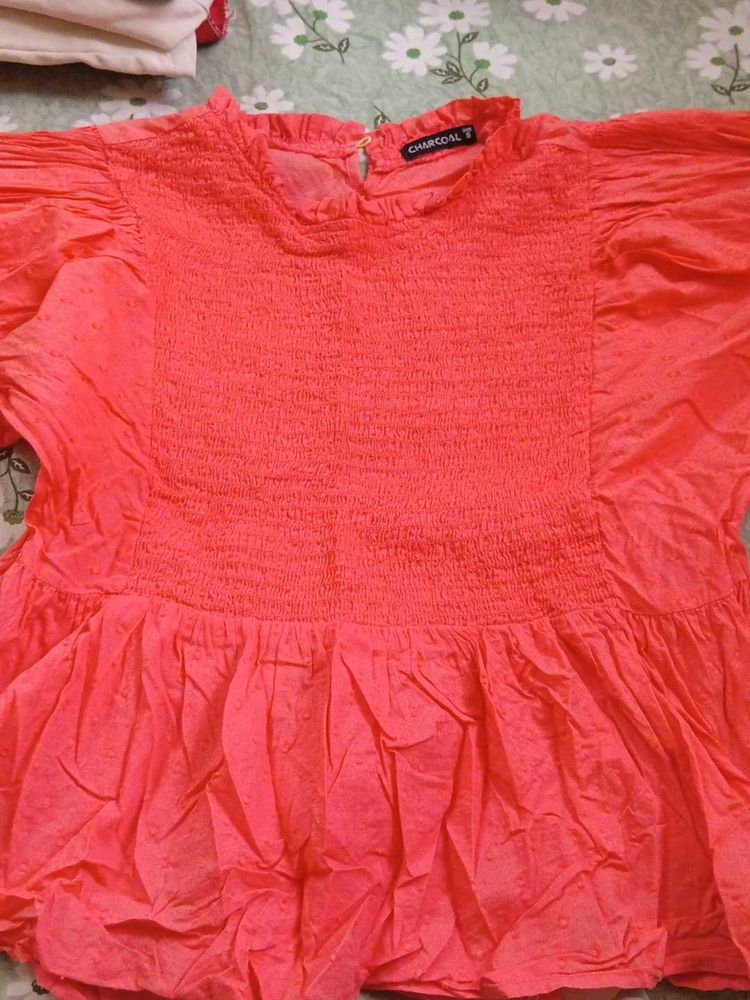 Coral Smocked Peplum Top