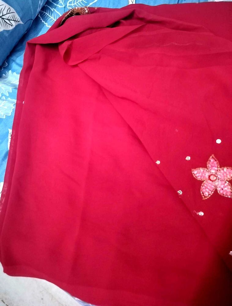 Elegant Red Saree with Floral Detail