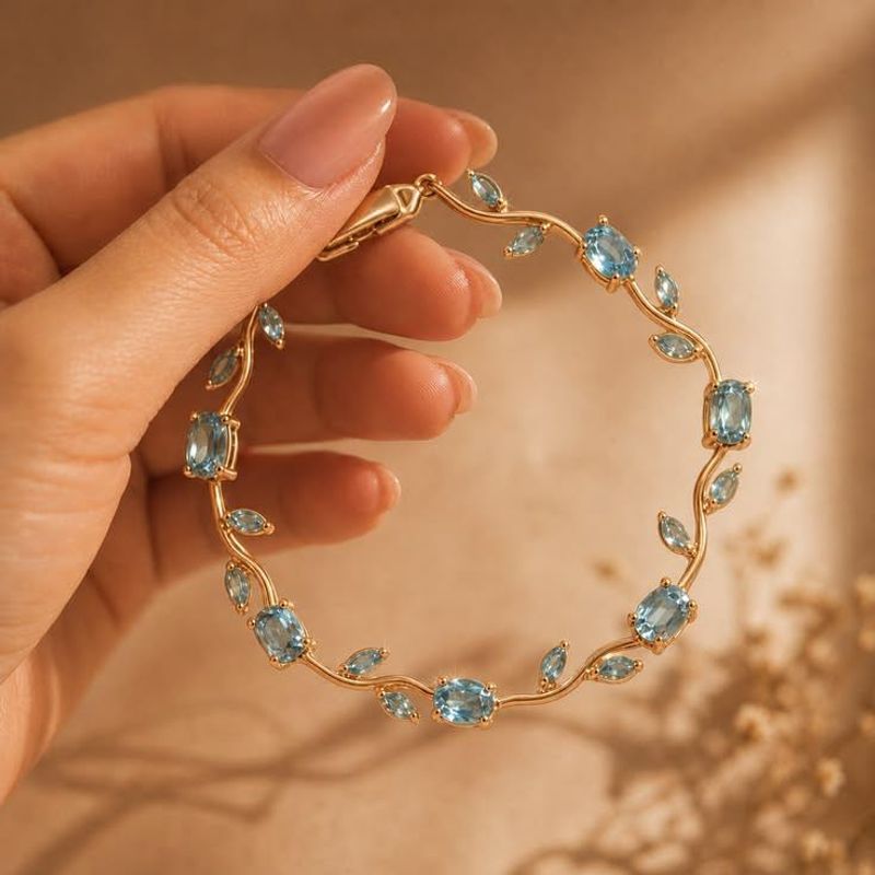 Elegant Gold Bracelet with Blue Stones
