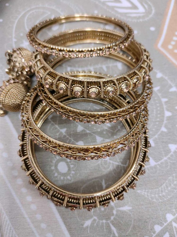 Set of Elegant Gold Bangles with Stones