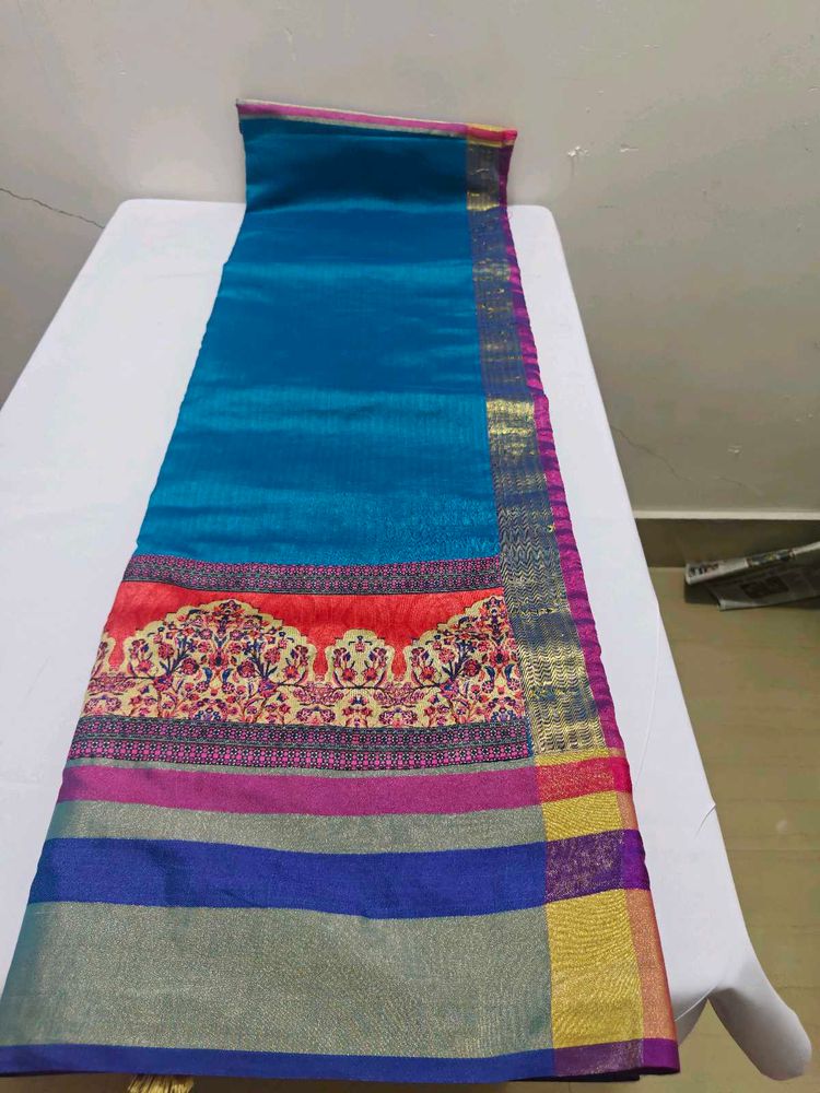 Vibrant Teal Saree with Colorful Border
