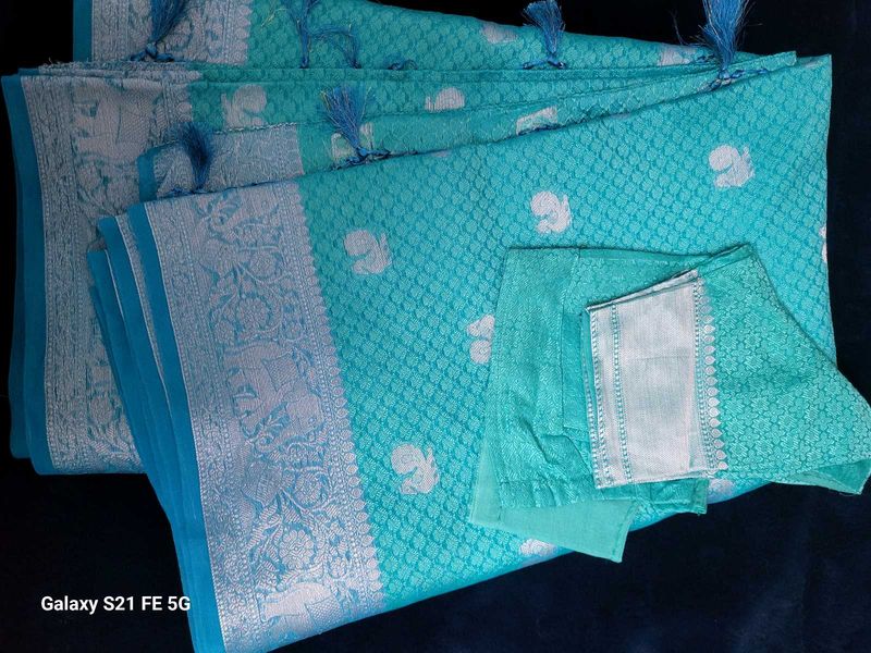 Elegant Teal Saree with Silver Weave