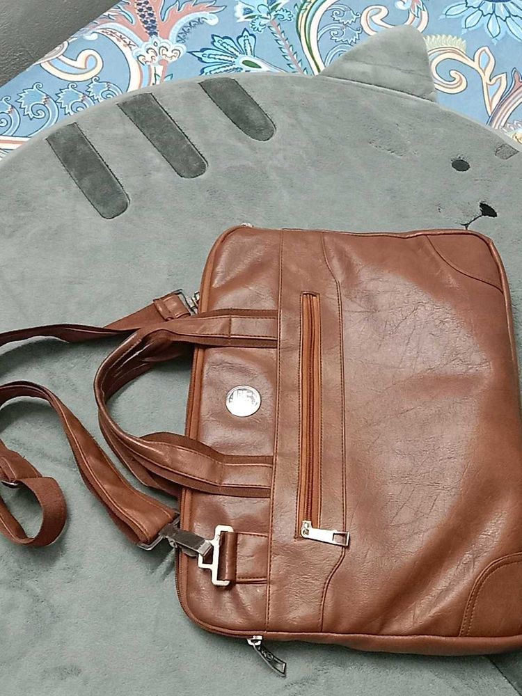 👜